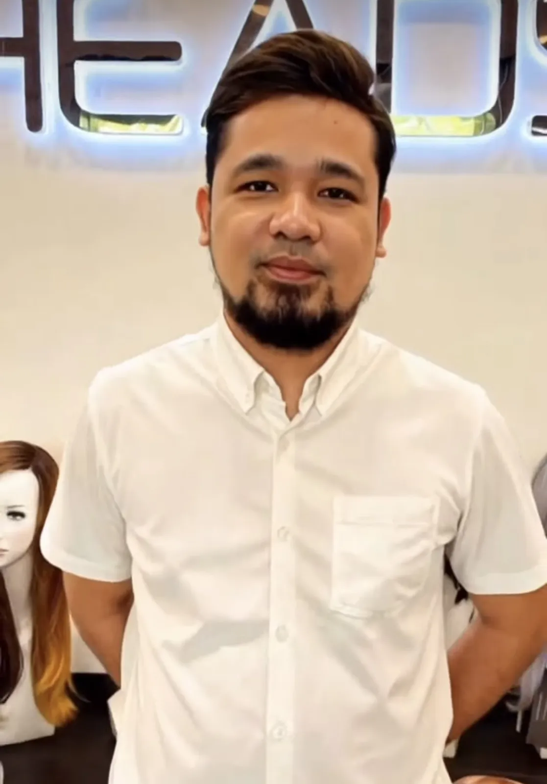 Happy HEADS client with his new hair system at the HEADS studio in Makati
