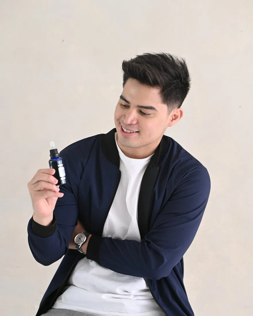 Man holding Volupropol hair care product