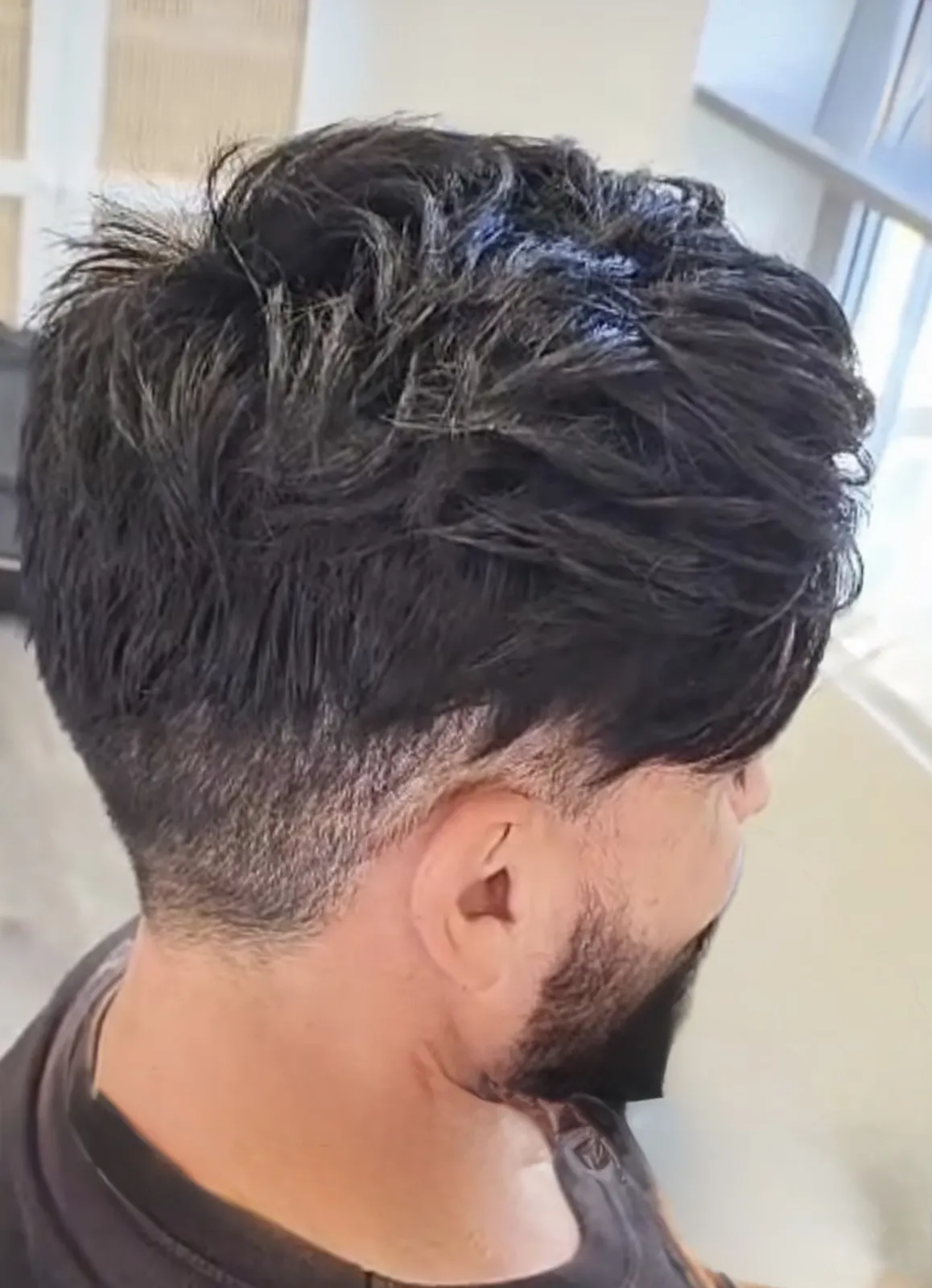 Real HEADS client — textured full hair after his hair system, back view