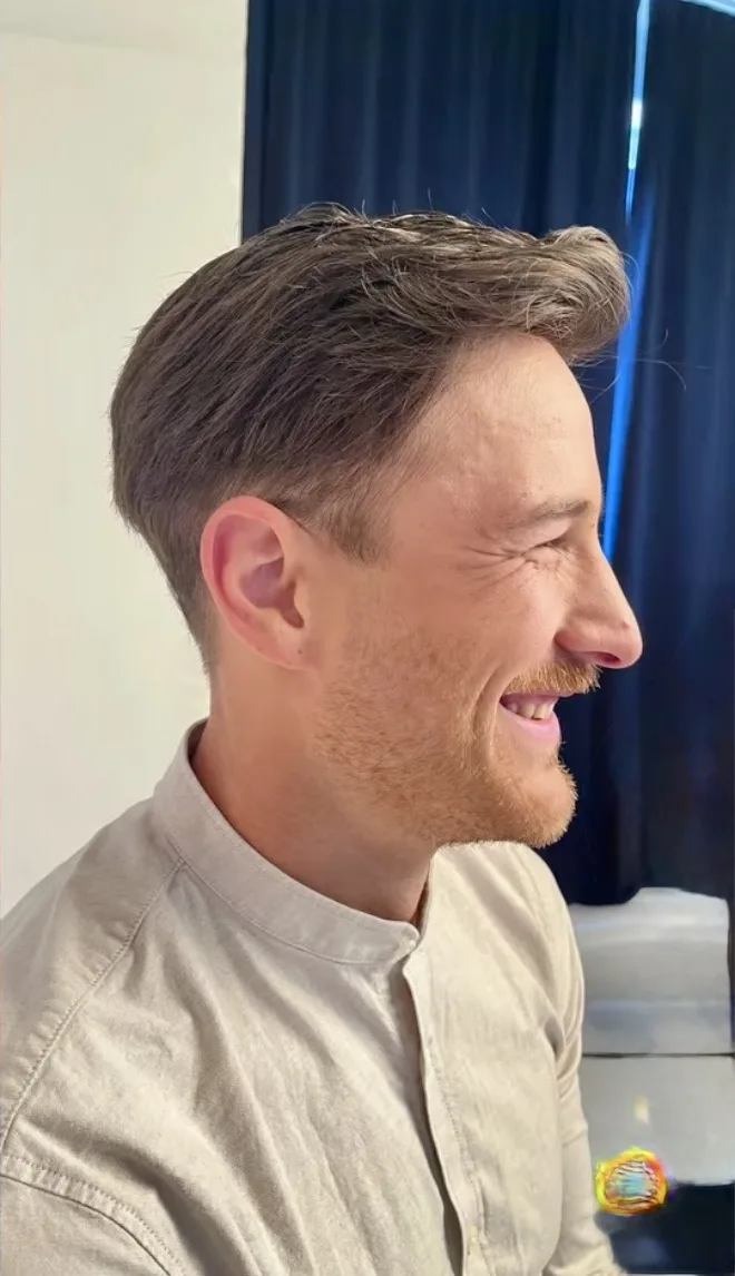 Real HEADS client — full styled hair after, smiling