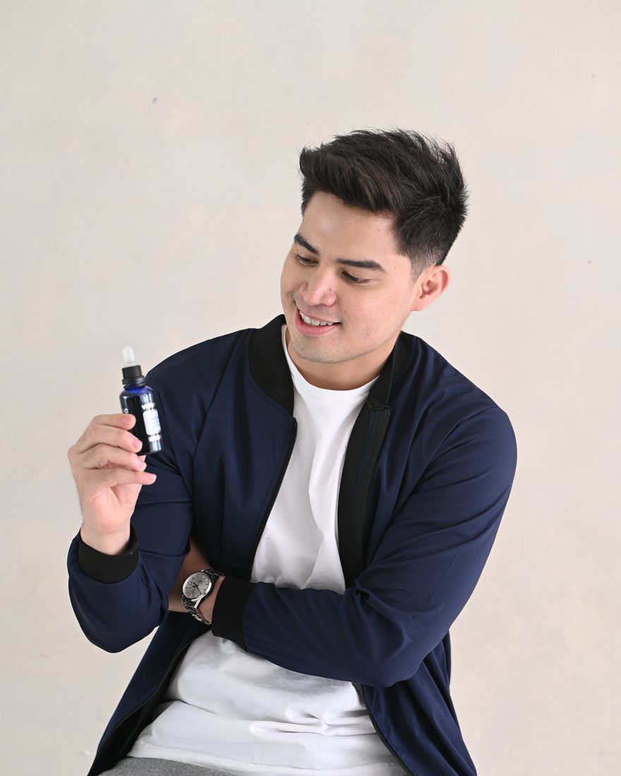 Man holding Volupropol hair care product
